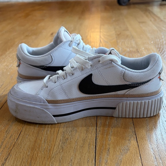 Nike White Low-Top Sneakers with Black Swoosh and Gold Accent - Picture 12 of 15